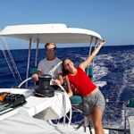Watch leader Wedolin and Elodie at the raised helm station of the Rapido 60 trimaran Ineffable.